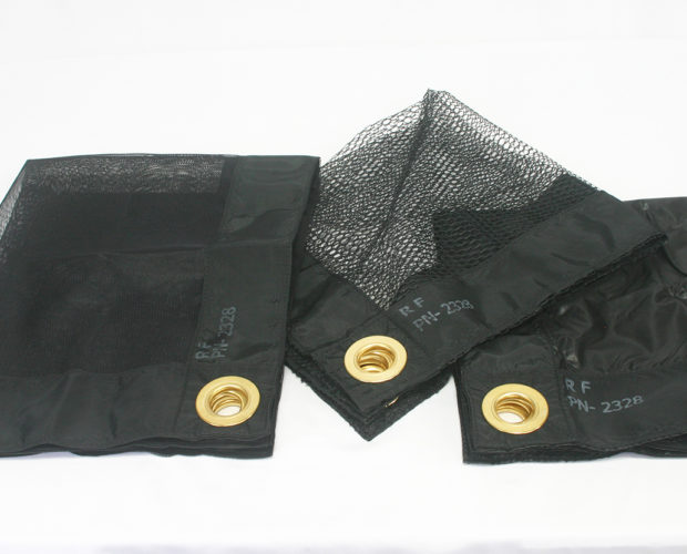 Black mesh panels with brass grommets