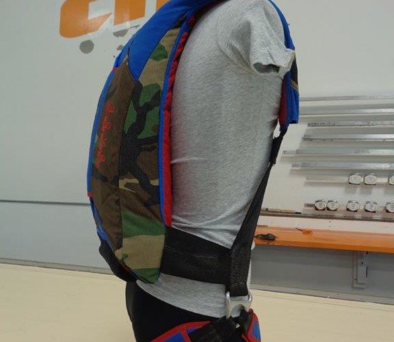 Mannequin wearing camo and blue safety harness