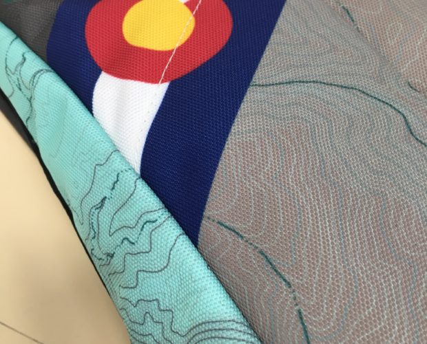 Gray backpack with Colorado flag patch